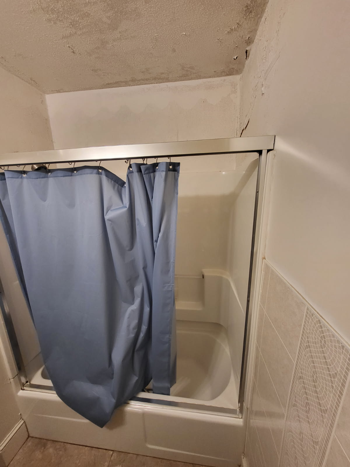 Bathroom before VA HISA accessible shower remodel