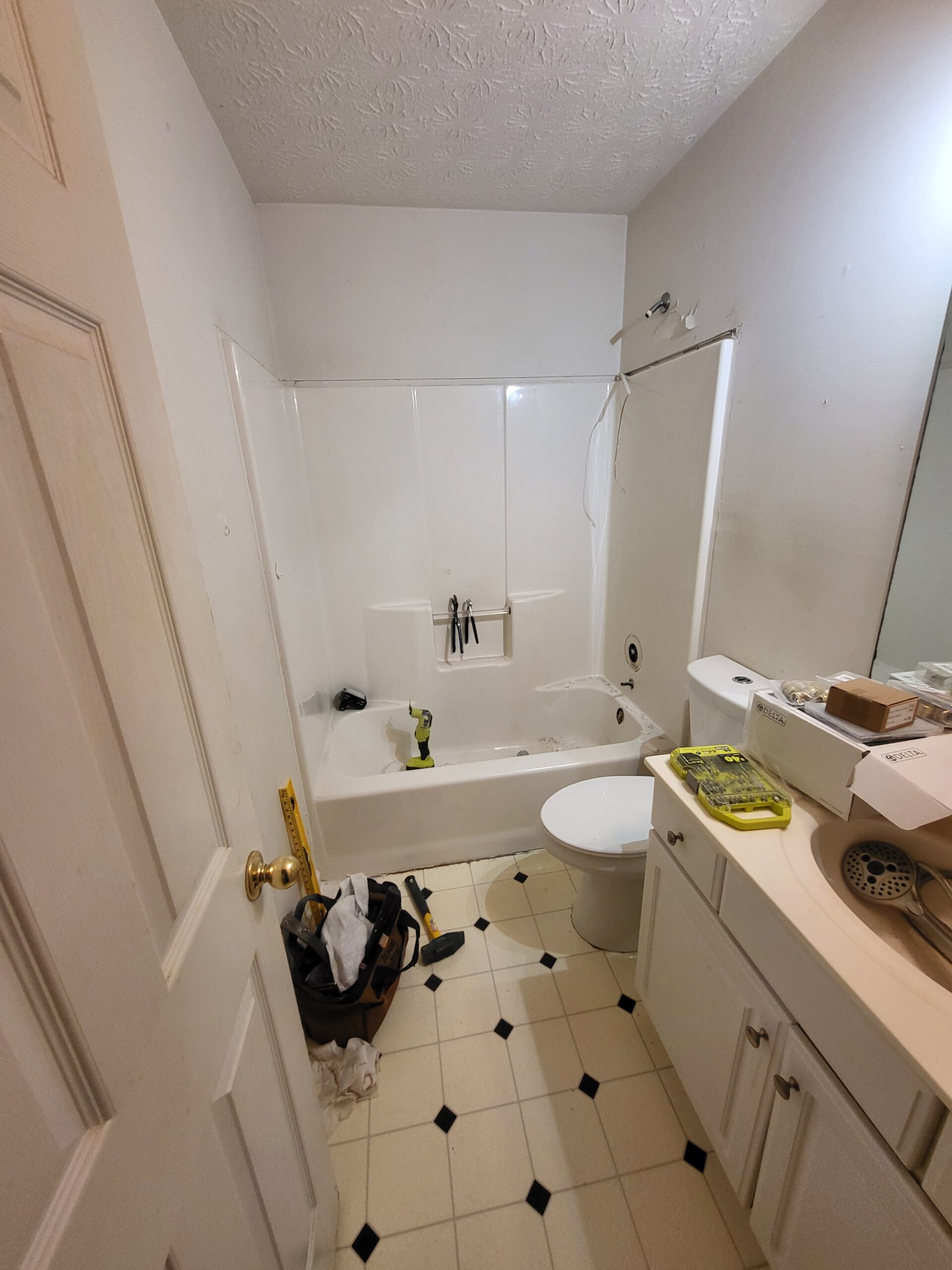 Bathroom before VA HISA accessible shower remodel